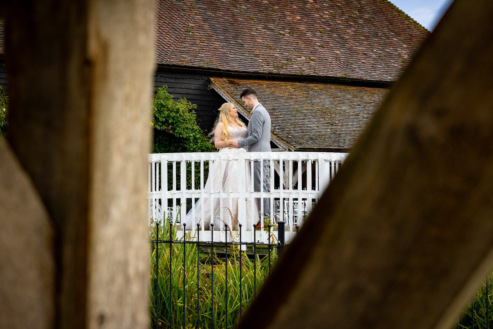 Ashleigh and Kieran portrait on the bridge at Winters Barns