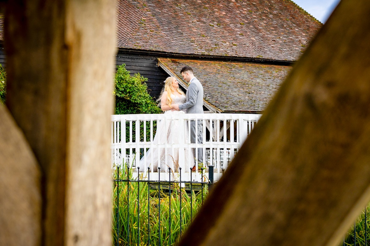 Kent wedding portrait on the bridge at Winters Barns
