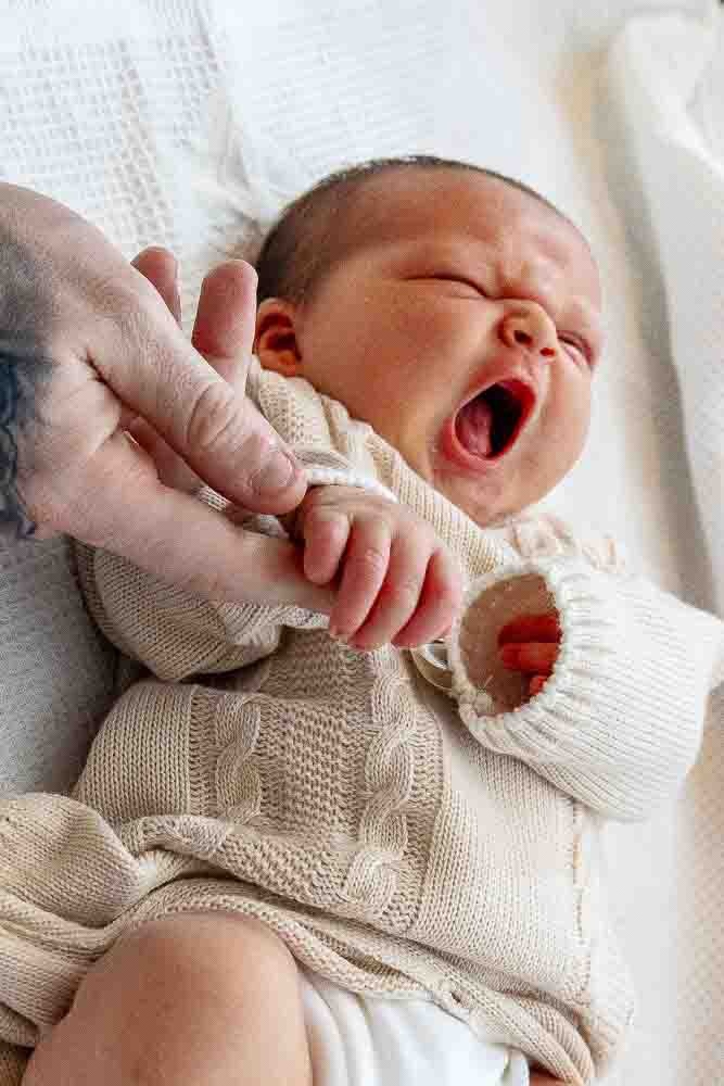 A baby yawning and photographed by Marcus The Photographer