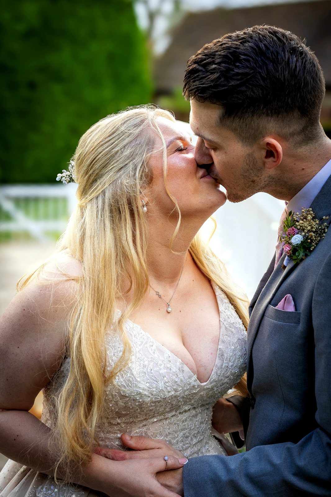 Bride and groom kissing at Winters Barns wedding in Kent